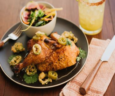 Honey Jalapeño Lacquer Roasted Chicken is soaked in Southern sweet tea brine and glazed with jalapeño-steeped honey syrup.
