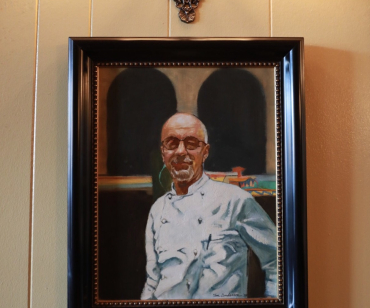 A painting of Jean-Claude presides over the dining room Photo: Katrina Wittcamp